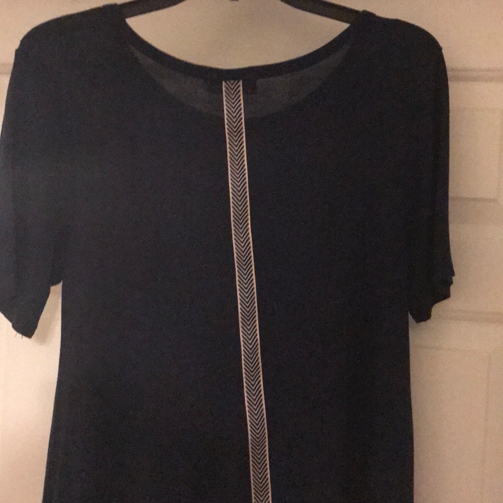 Navy top with design down back